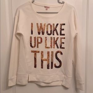 Cream colored long sleeve shirt with gold sequins